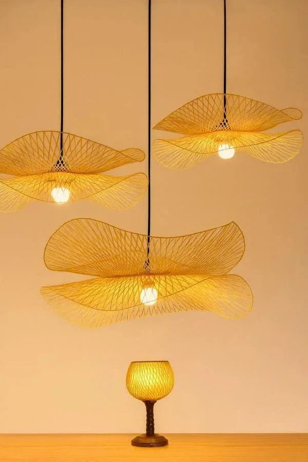 Decorative pendant lights with a warm glow on a beige wall