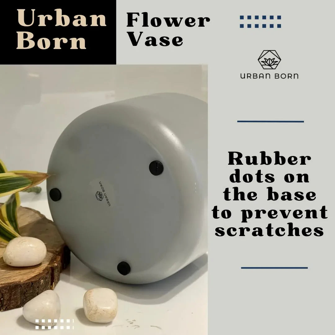 White flower vase with rubber dots on the base