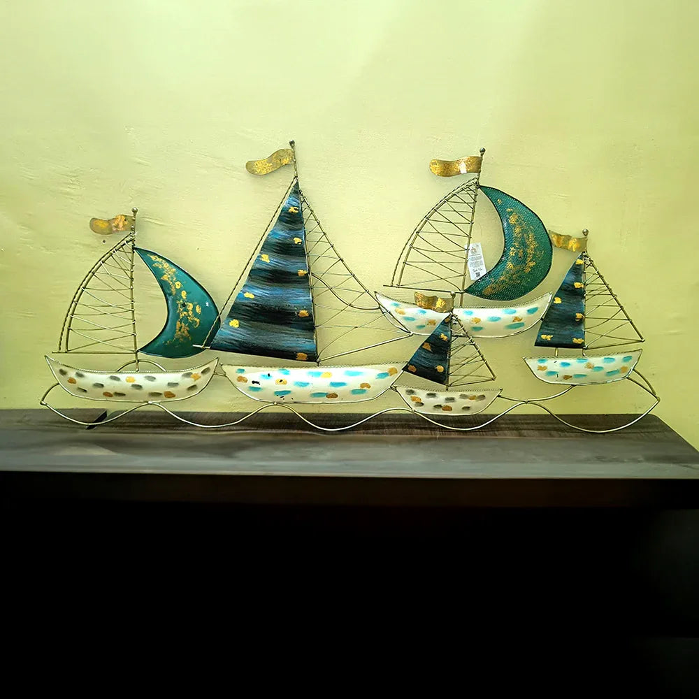 Decorative metal wall art of sailboats on a plain background