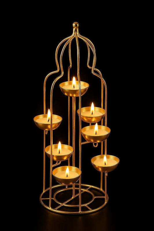 Gold candle holder with multiple lit candles on a black background