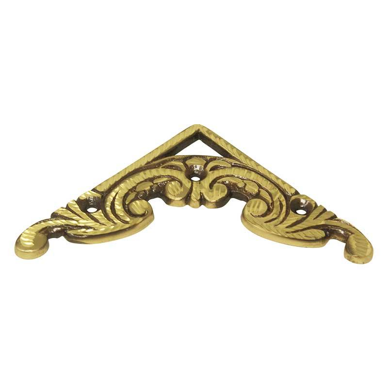Ornate brass corner bracket with floral engraved design
