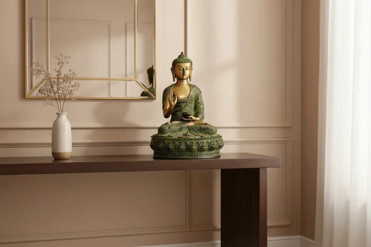 Handcrafted 15-inch solid brass Buddha idol seated in Abhaya Mudra with Tibetan green-gold oxidised finish, engraved robe with narrative scenes, and lotus base - ArtyCraftz
