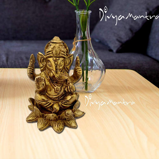 Brass Chaturbhuja Ganapati On Lotus Idol