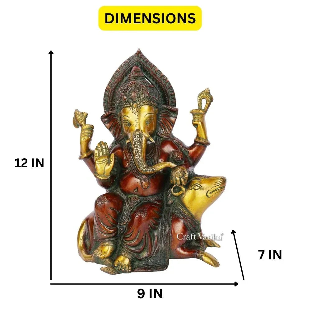 Handcrafted 12-inch solid brass Ganesha idol seated with Mooshika beside him — copper and green two-tone antique finish, ornate arch crown, four arms in blessing pose — ArtyCraftz