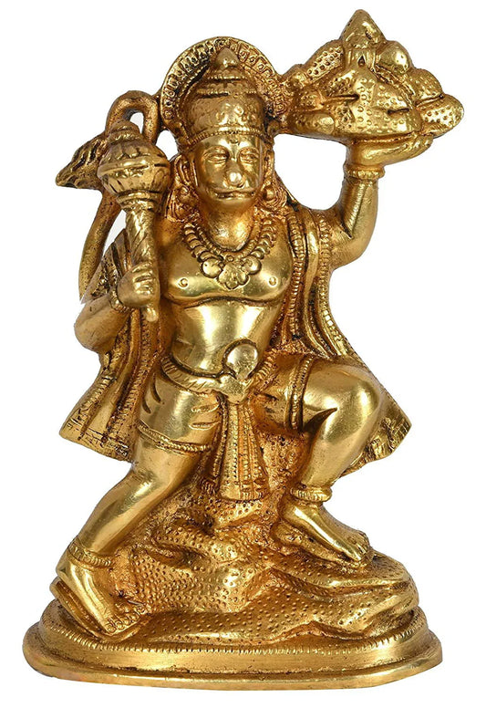Handcrafted 6.5-inch solid brass Hanuman idol — flying pose carrying Sanjeevani mountain in right hand and gada in left, antique gold finish on oval base — ArtyCraftz