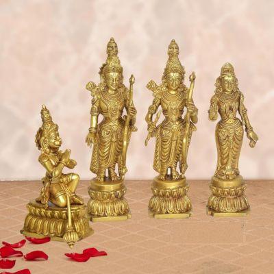 A set of four gold-colored brass idols, depicting characters from the Hindu epic Ramayana, seated on a round platform with a small figure of a deity on the left side.