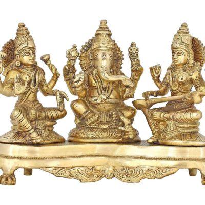 Handcrafted 9-inch solid brass Lakshmi Ganesha Saraswati trio idol set on ornate footed base — three deities together in warm antique gold finish — ArtyCraftz