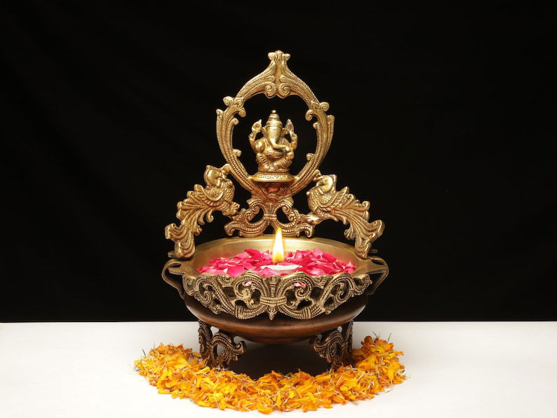 Decorative Brass Ganesha with Peacock Urli Bowl - ArtyCraftz.com