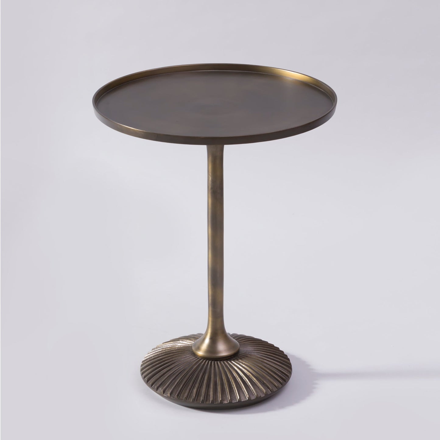 Brass side table with a textured base