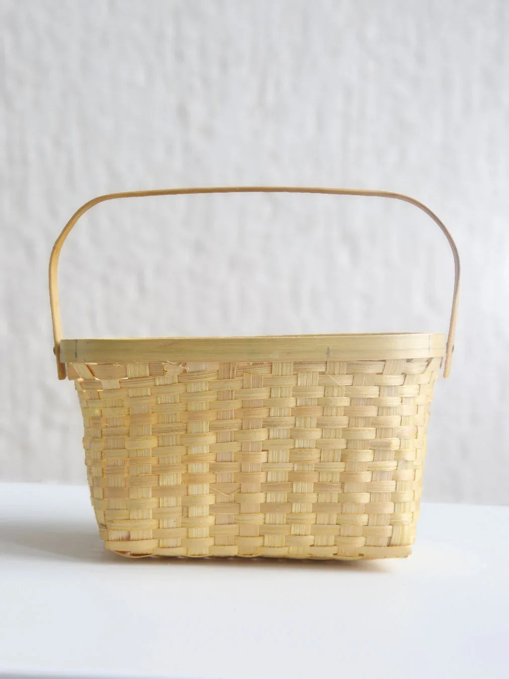 Woven basket with a handle
