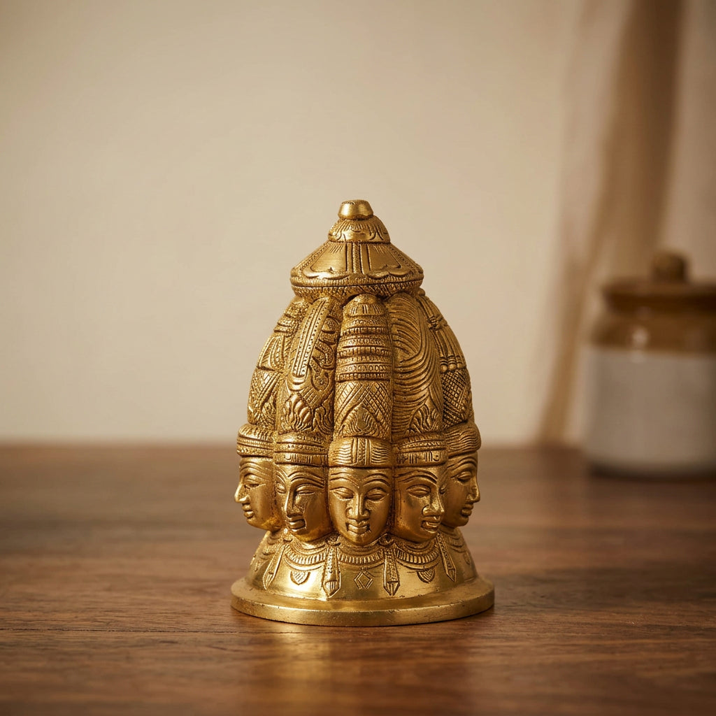Golden brass nine-faced Shiva statue with an ornate crown-like top and intricately carved circular base-artycraftz.com