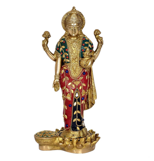 Handcrafted 10-inch standing solid brass Lakshmi idol — red and green stone inlay saree with gold leaf motifs, lapis blue cabochons, mirror work and lotus base — ArtyCraftz