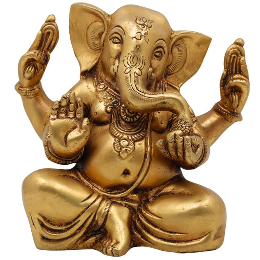 Handcrafted 16 cm solid brass Ganesha idol seated in Sukhasana with Om and lotus engraved on forehead, four arms in blessing pose, antique gold finish — ArtyCraftz
