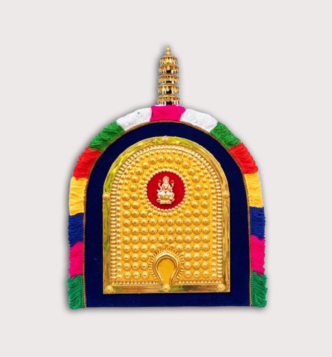 Handcrafted 2 feet Kerala Thidambu wall decor with embossed gold-tone design and colorful traditional fabric border for home temple and Kerala-style interiors.-ArtyCraftz.com