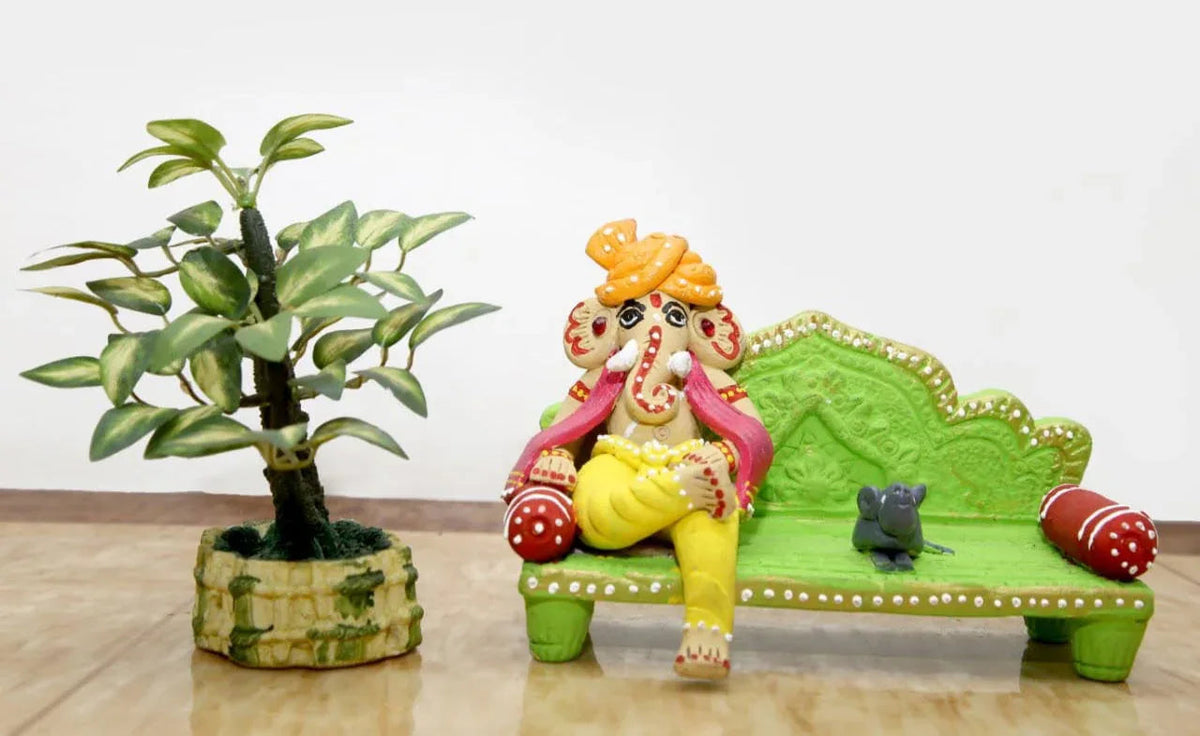 Handmade Terracotta Ganesh with mooshika with Green sofa Idols for Gifting - ArtyCraftz.com