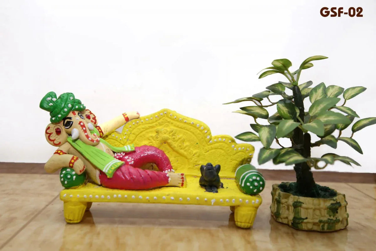 Handmade Terracotta Lying Ganesh with mooshika with Yellow sofa Idols for Gifting - ArtyCraftz.com