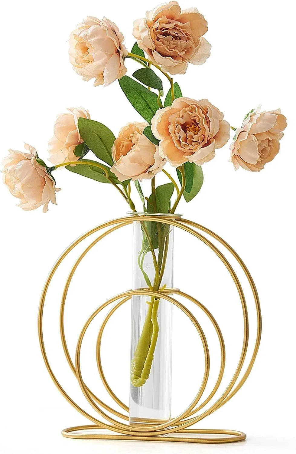 Clear vase with peach-colored flowers in a gold circular holder on a white background