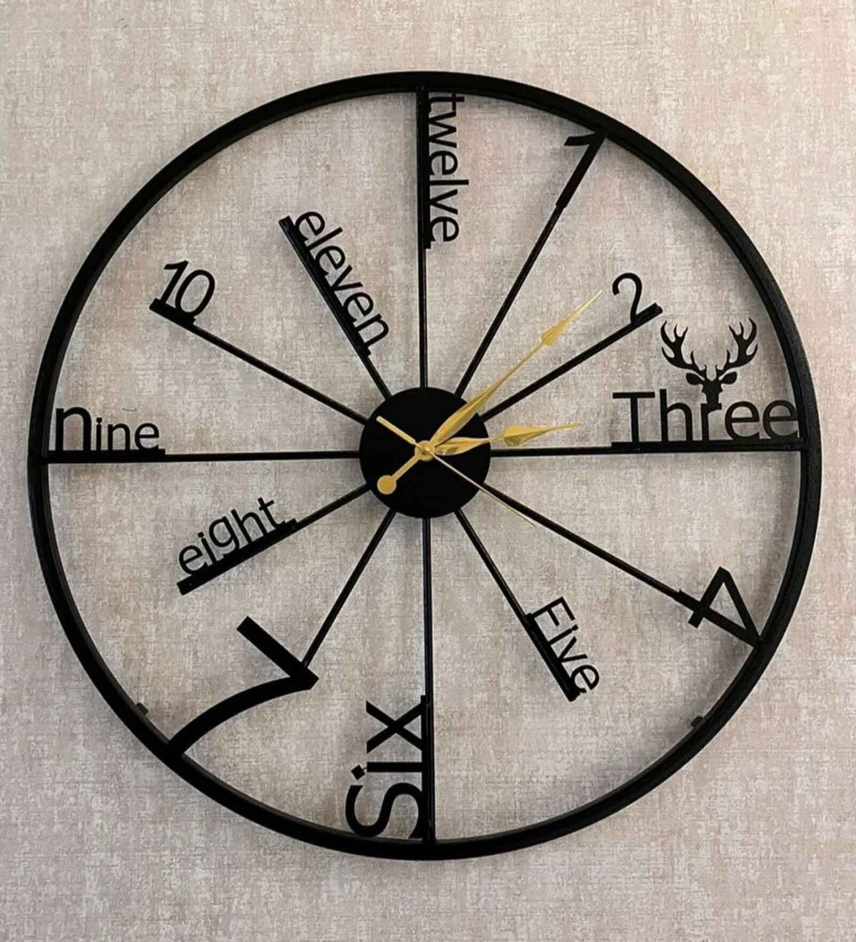 24-inch round black iron wall clock with gold-tone hands and artistic numerals-artycraftz.com
