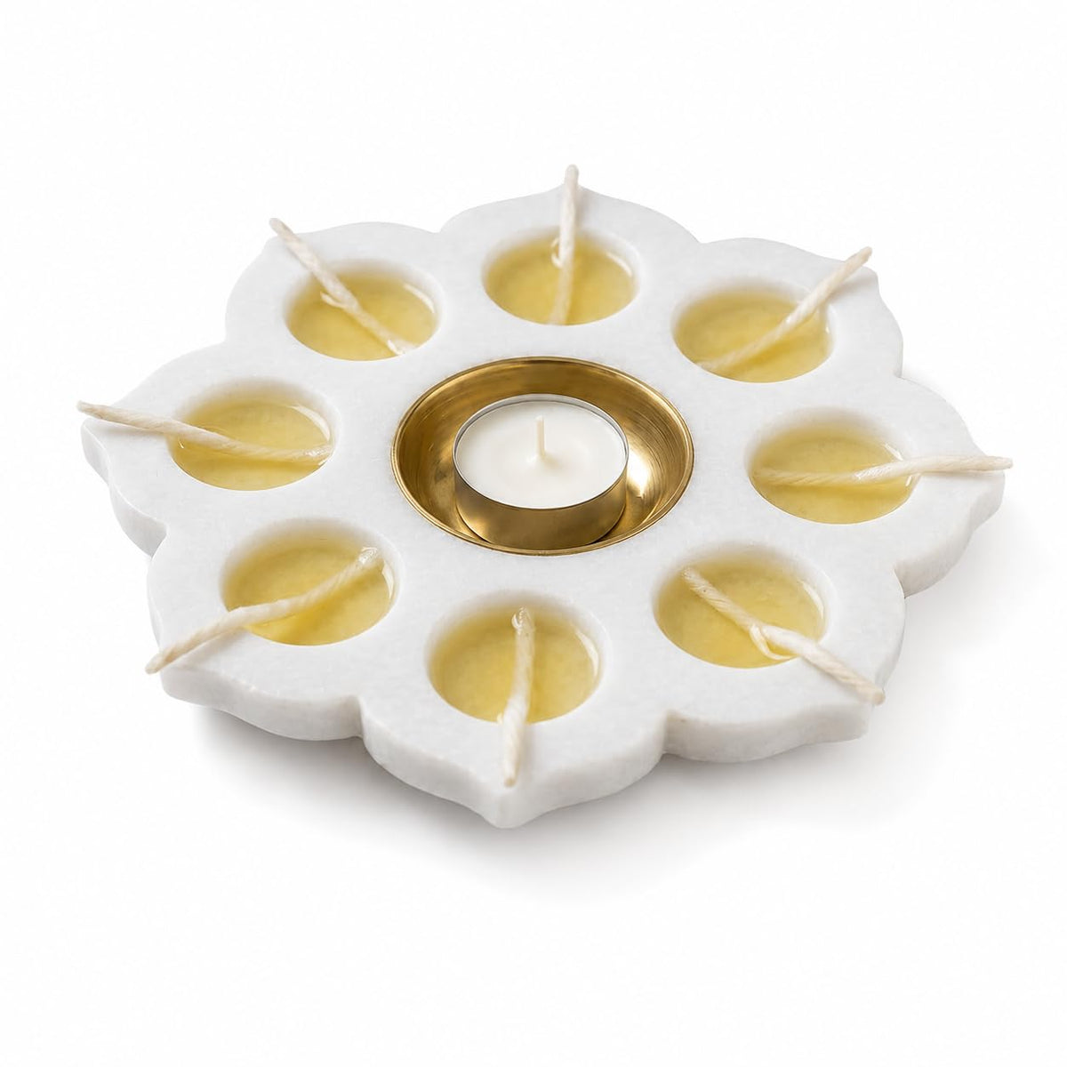 White marble flower-shaped candle holder with eight outer wells and a central brass-finish cup-artycraftz.com