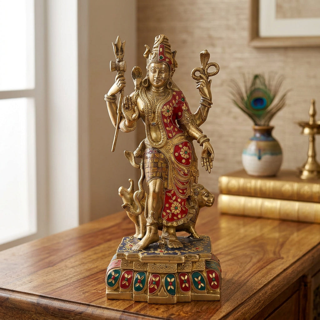 Brass Ardhanarishvara statue with golden finish, red and green decorative accents and ornate pedestal-artycraftz.com