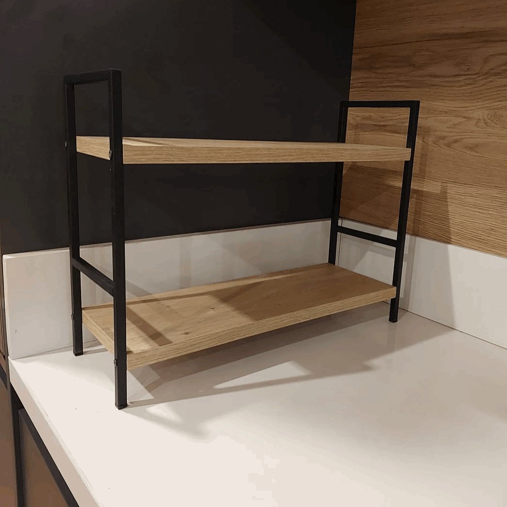 Wooden shelf with black metal frame against a dark wall