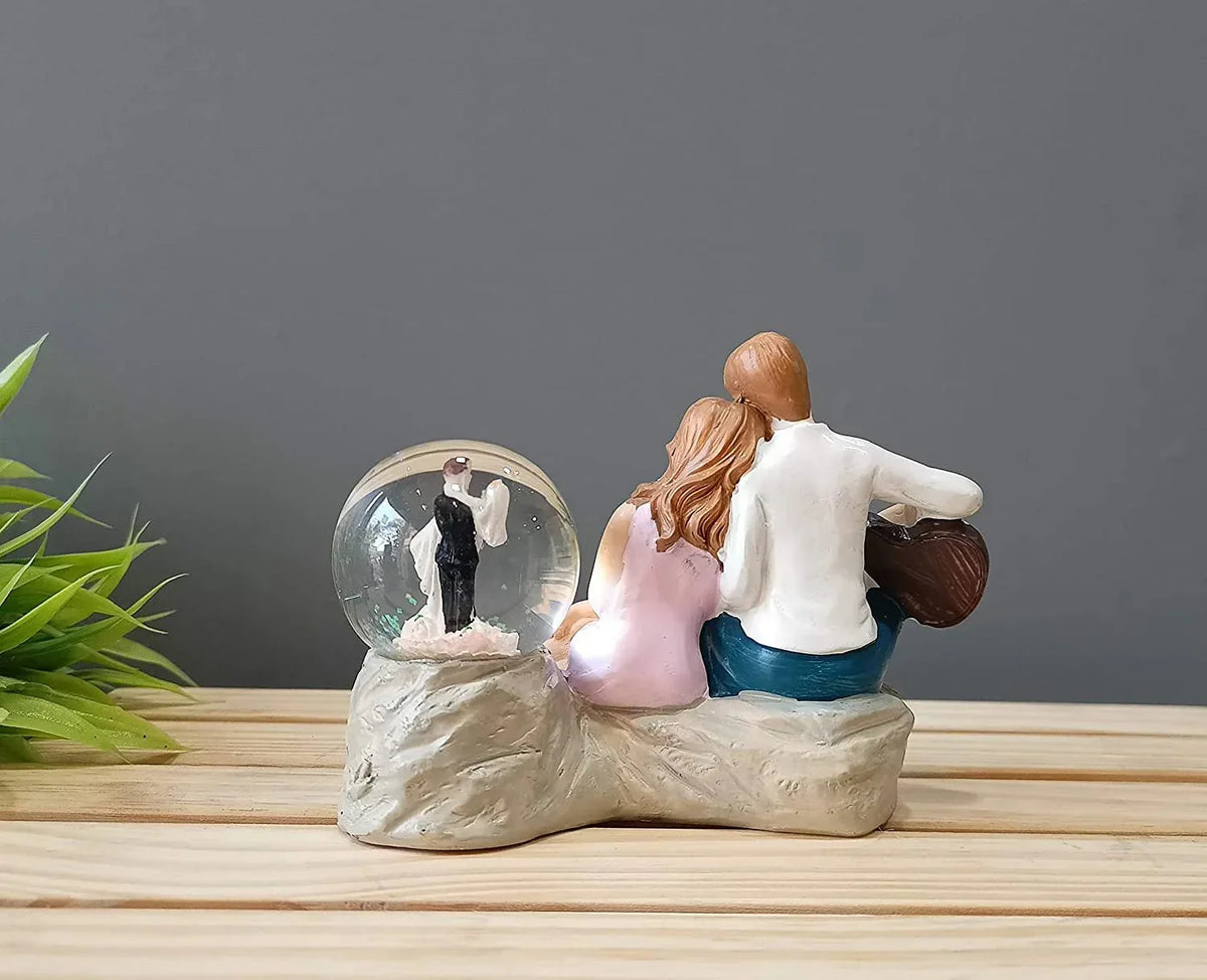 Resin Couple with Crystal Ball Showpiece - ArtyCraftz