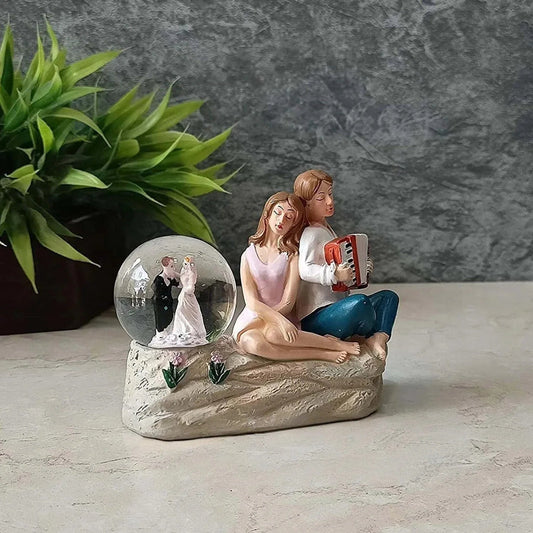 Resin Couple with Crystal Ball Showpiece - ArtyCraftz
