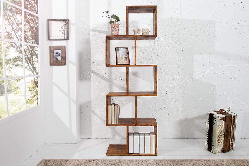 Wooden bookshelf with books and decorative items in a bright room