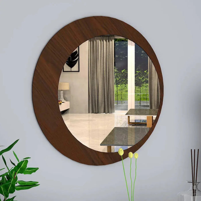 Round wooden mirror on a wall with a room reflection