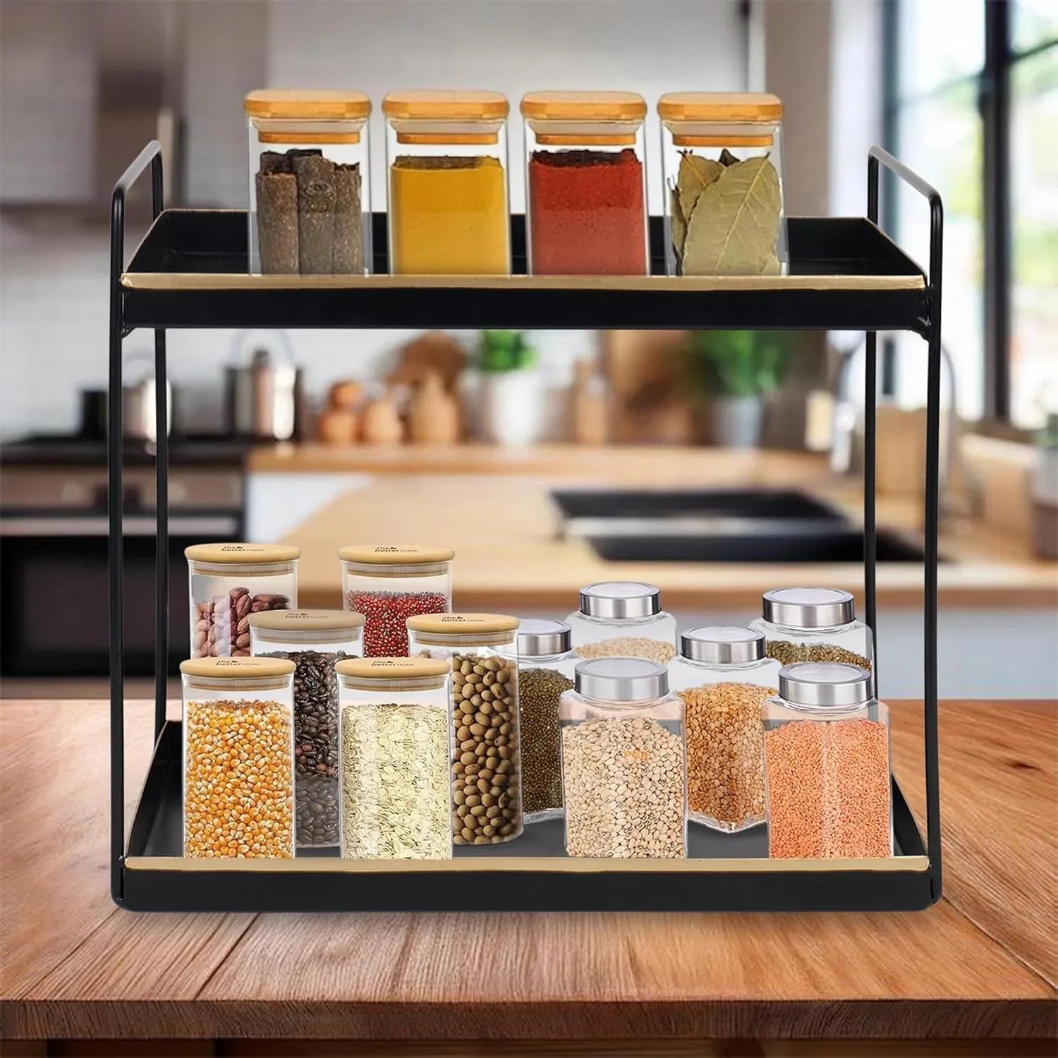 Spice rack with glass jars containing various spices on a kitchen counter.