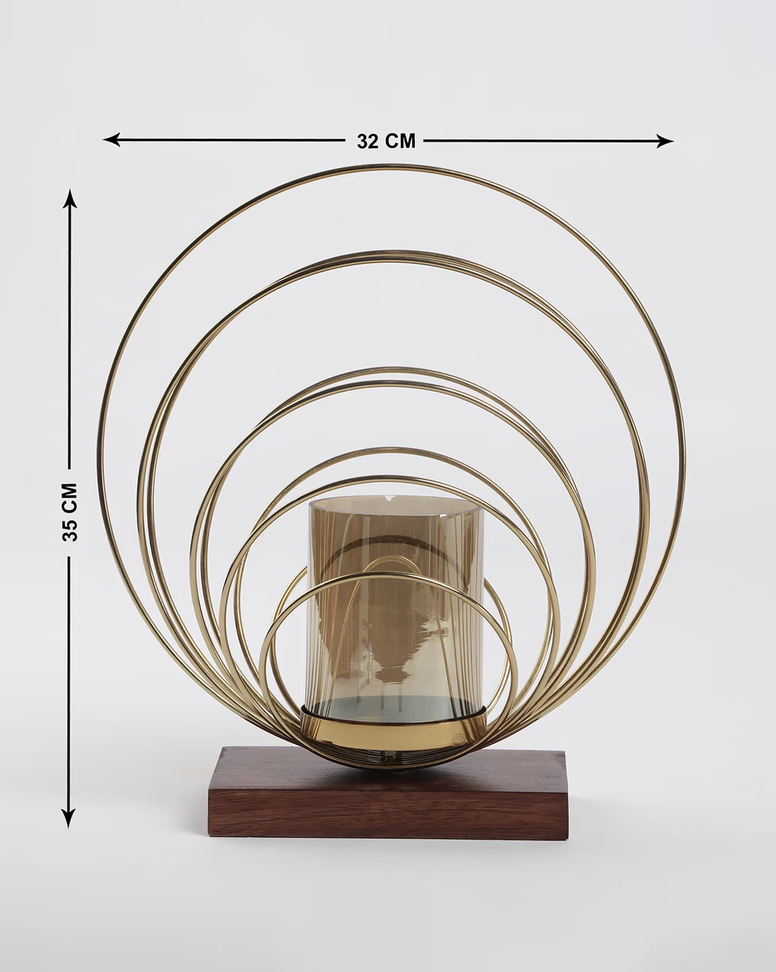 Decorative candle holder with gold circular design on a wooden base, shown with measurements.