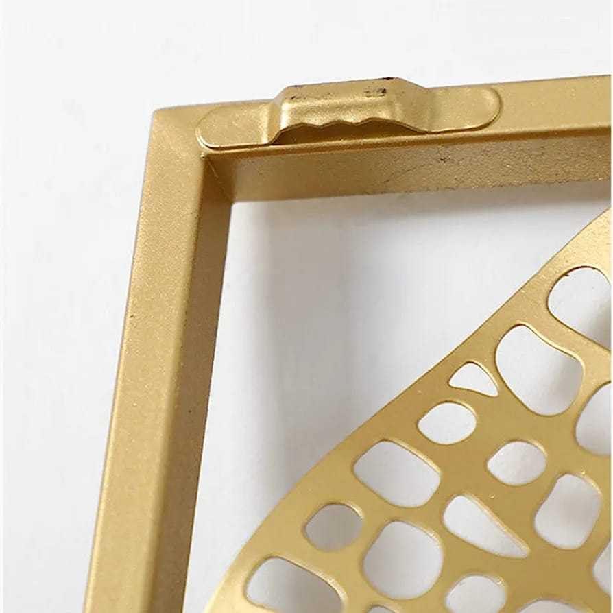 Gold decorative frame with geometric cutout design on a white background