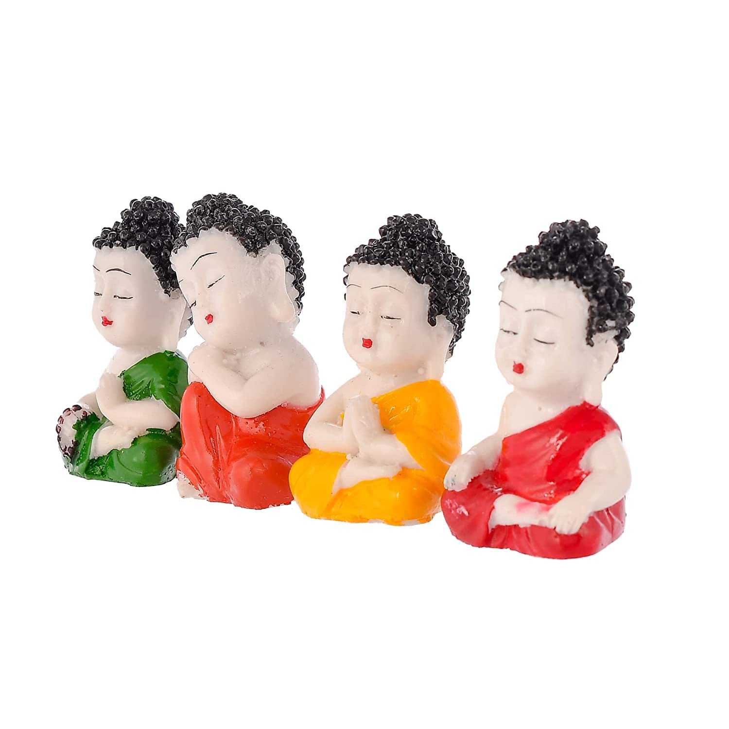 Four small figurines of a monk in different colored robes on a white background