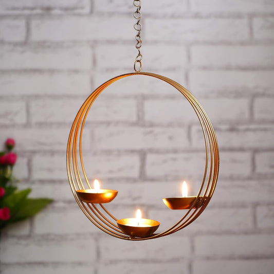 Gold circular hanging candle holder with three candles