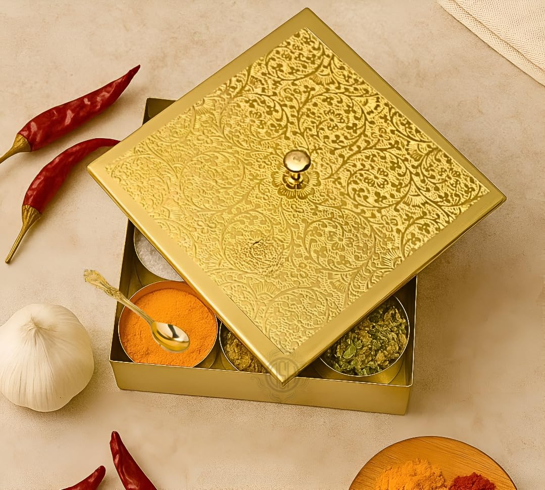 Decorative gold box with spices and a spoon