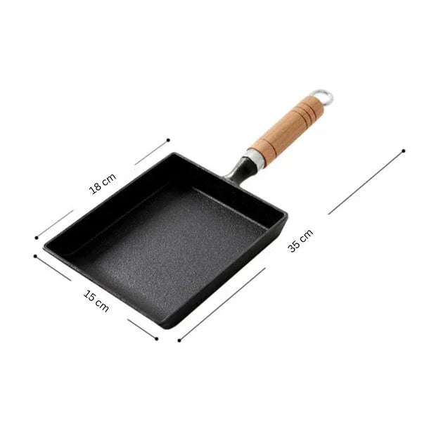 Small black frying pan with a wooden handle and dimensions