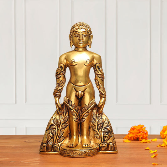 Gold Buddha statue on a wooden surface with a white paneled wall background