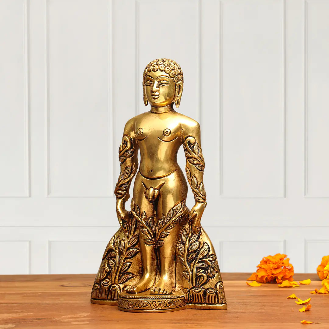 Gold Buddha statue on a wooden surface with a white paneled wall background