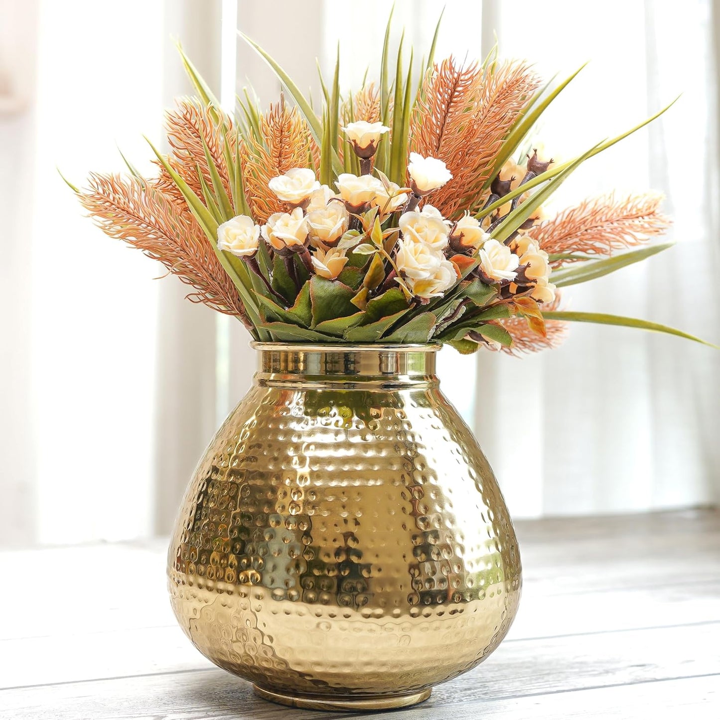 Gold vase with a bouquet of flowers