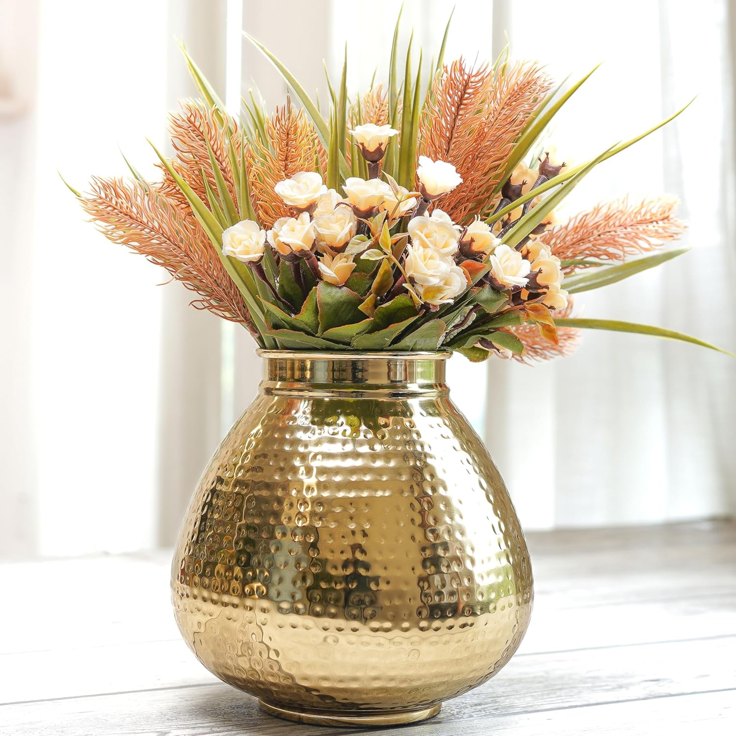 Gold vase with a bouquet of flowers