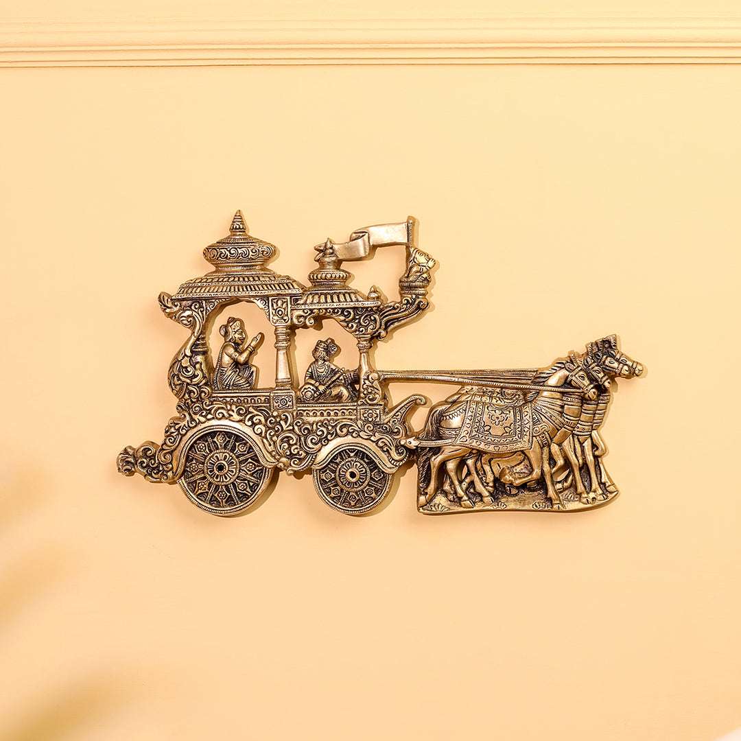 Decorative gold chariot with horses on a beige background