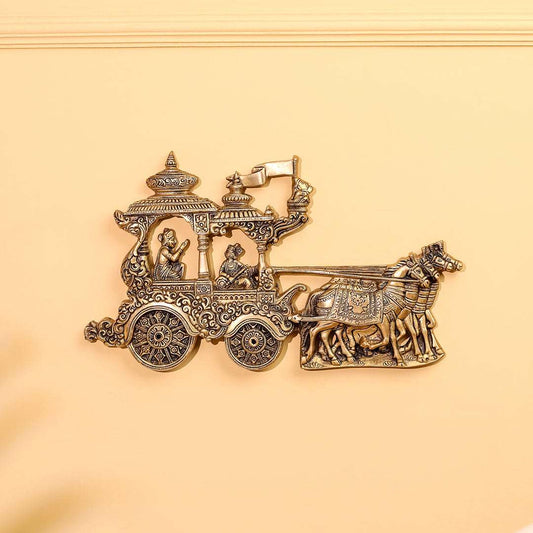 Decorative gold chariot with horses on a beige background