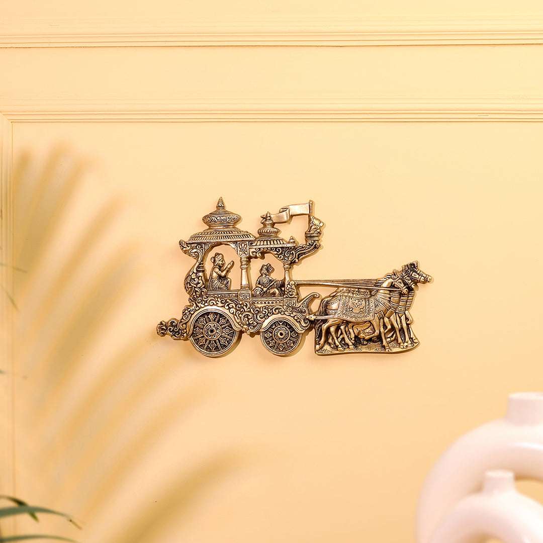 Decorative brooch of a carriage with figures on a yellow background