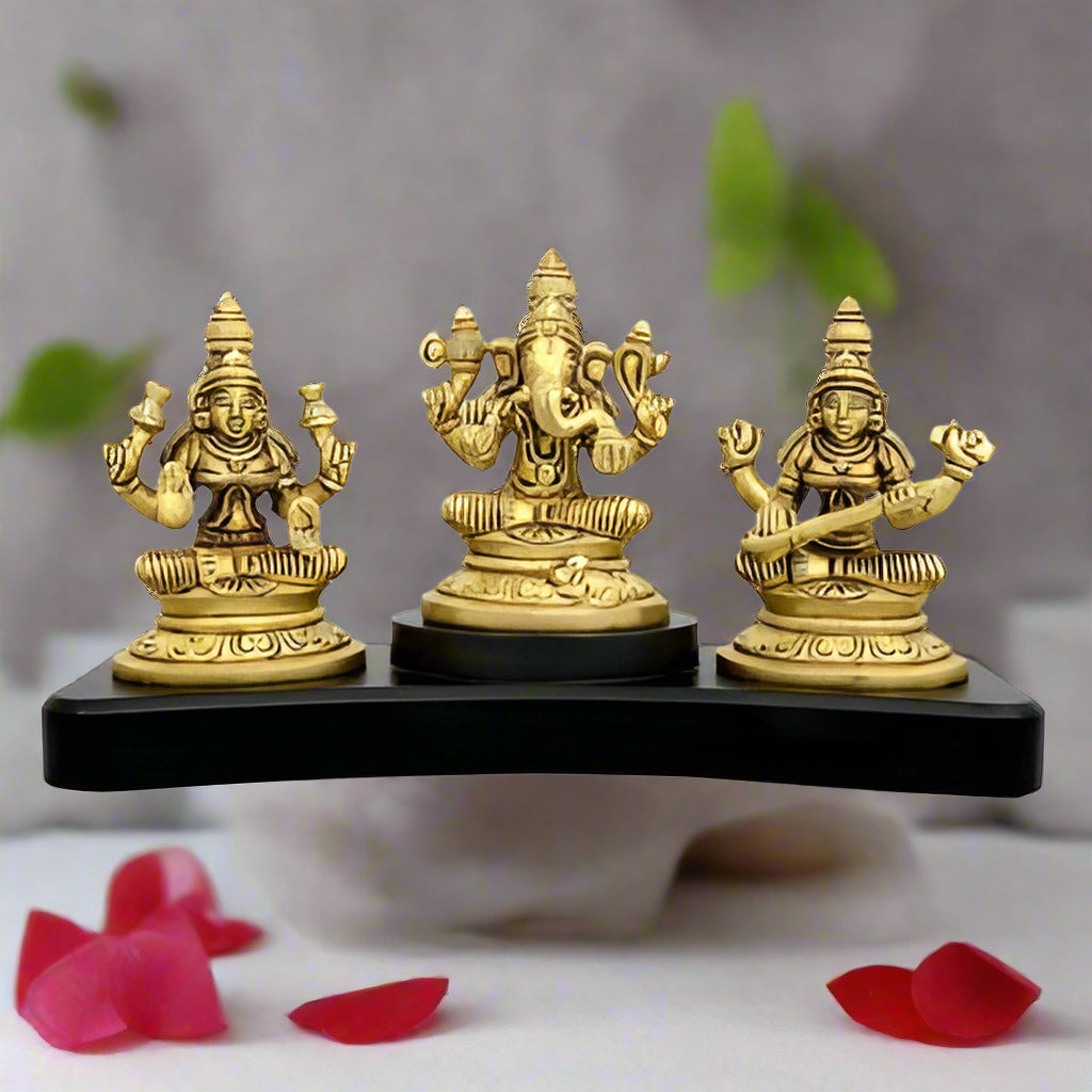 Brass Lakshmi Ganesha Saraswati Sitting on a Wooden Base-ArtyCraftz.com