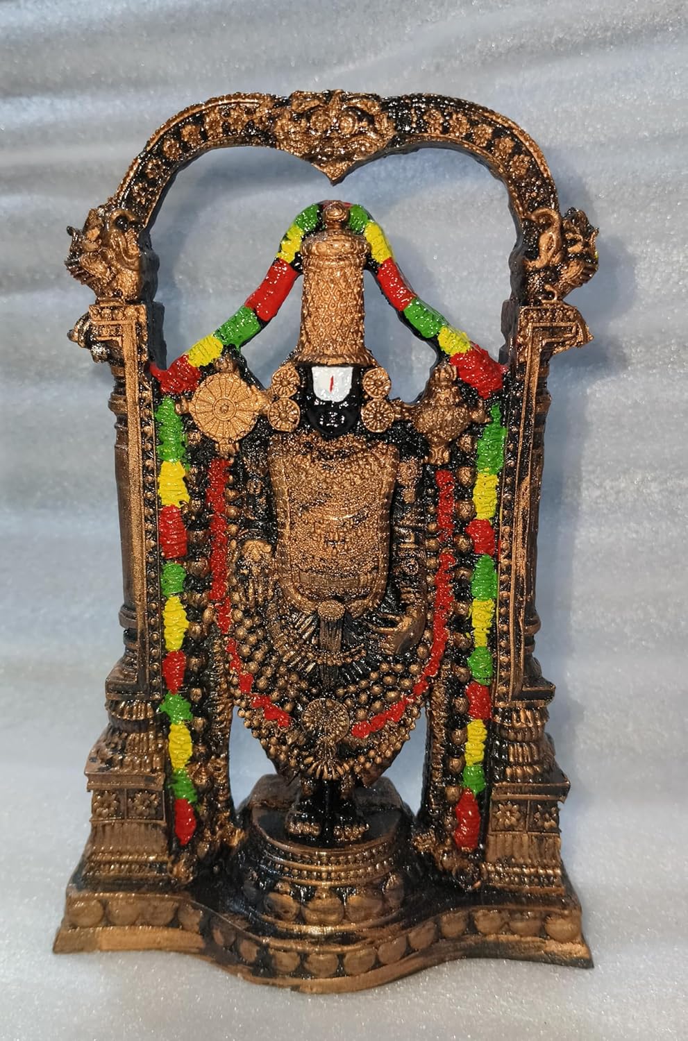 Handcrafted 21 cm polyresin Tirupati Balaji Venkateswara idol with decorative arch, temple pillars, colourful garlands and antique copper-black finish — ArtyCraftz