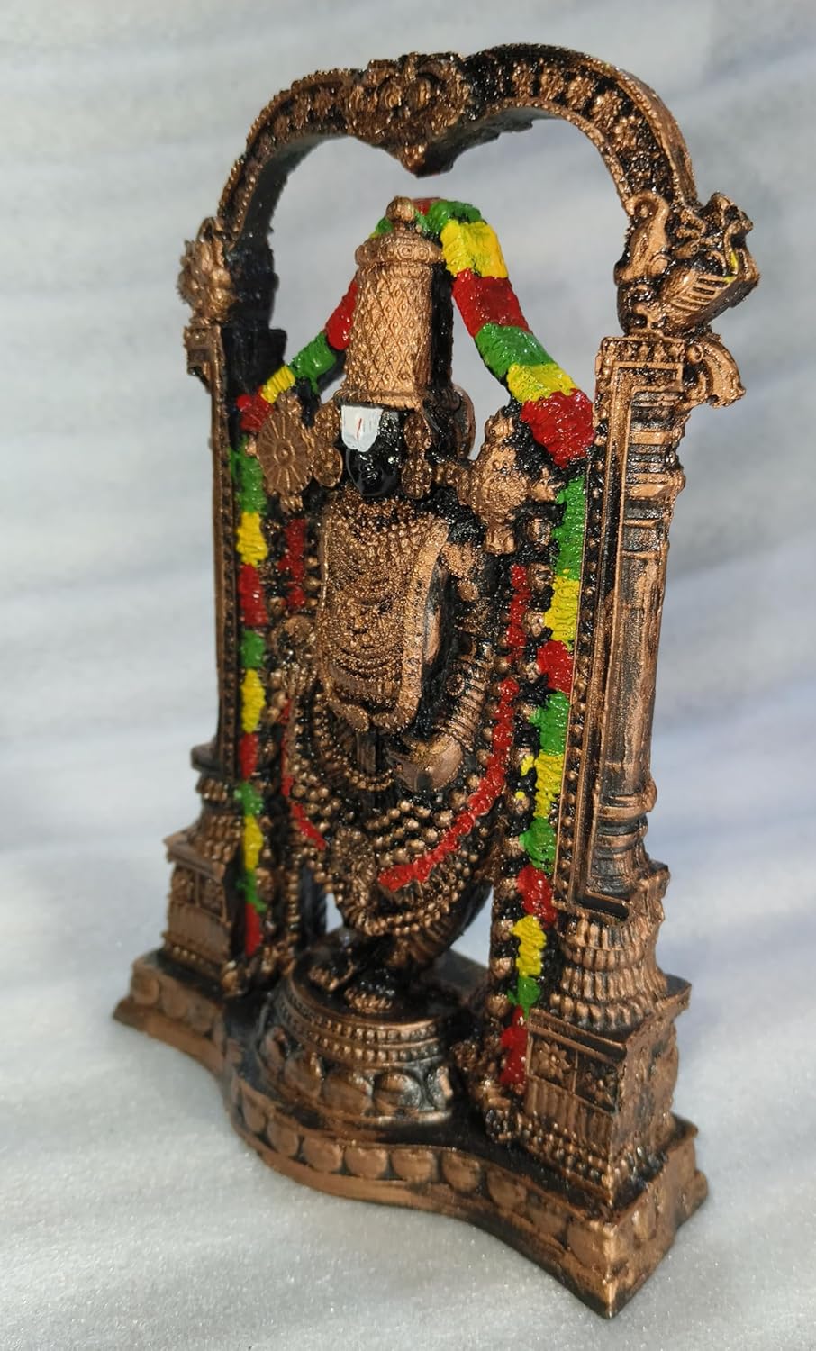 Handcrafted 21 cm polyresin Tirupati Balaji Venkateswara idol with decorative arch, temple pillars, colourful garlands and antique copper-black finish — ArtyCraftz