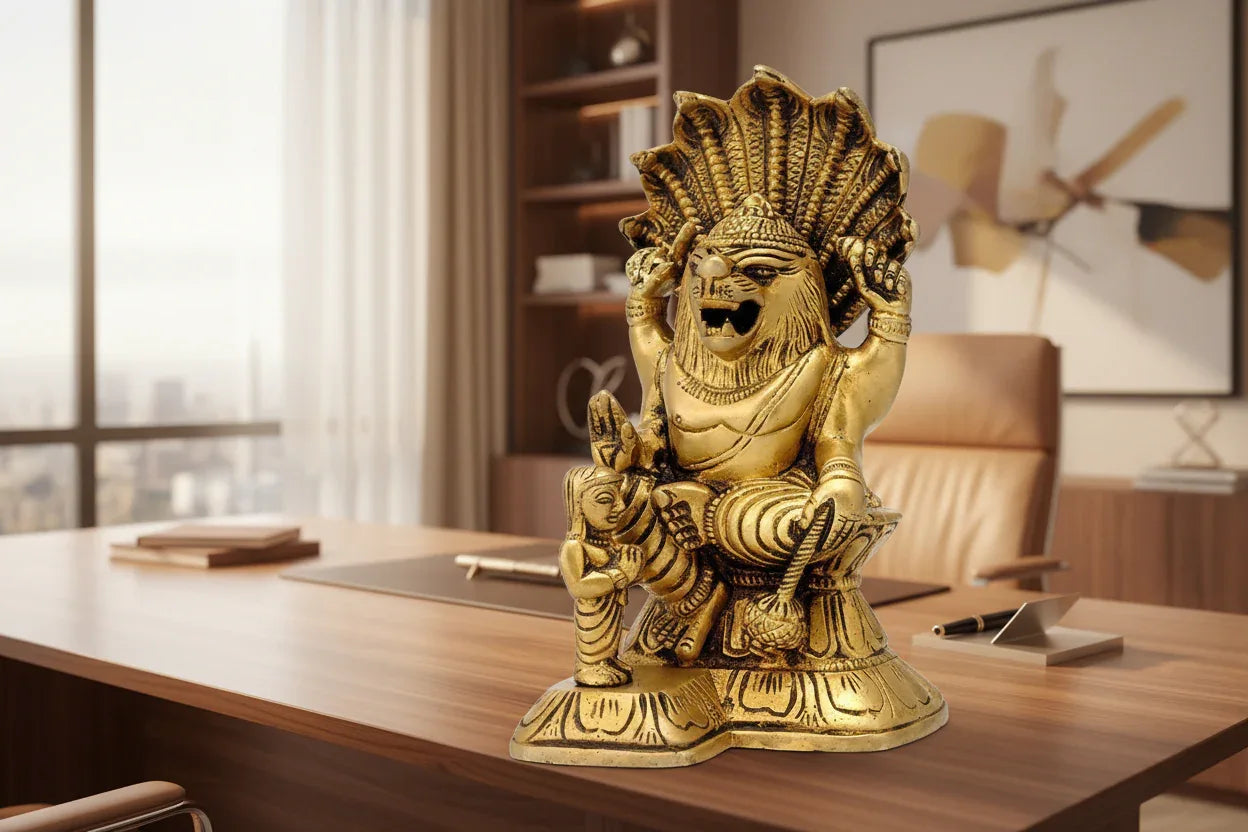 Handcrafted 5.5-inch solid brass Narasimha idol with young Prahlad devotee standing beside him, lion-man form with Sheshnag hood crown, antique gold finish — ArtyCraftz