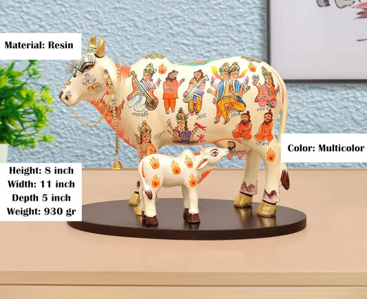 Handcrafted 8-inch resin Kamdhenu cow with calf — hand-painted multicolour with Hindu deities and saints including Hanuman, Narad, Saraswati and sages, gold hooves and brass bell chain — ArtyCraftz