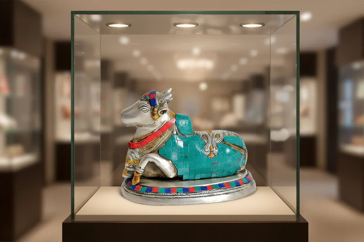 Handcrafted 9.5-inch white brass Nandi idol with extensive turquoise mosaic and coral red stone inlay, silver-tone finish with gold accents, on stone-inlaid oval base — ArtyCraftz