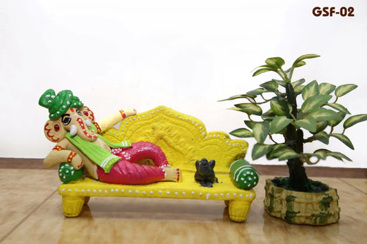 Handmade Terracotta Lying Ganesh with mooshika with Yellow sofa Idols for Gifting - ArtyCraftz.com